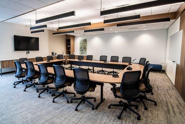 a conference room with a large table and chairs